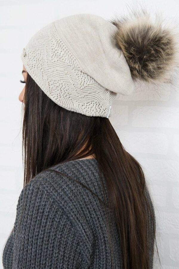 Beige hat with a pompon